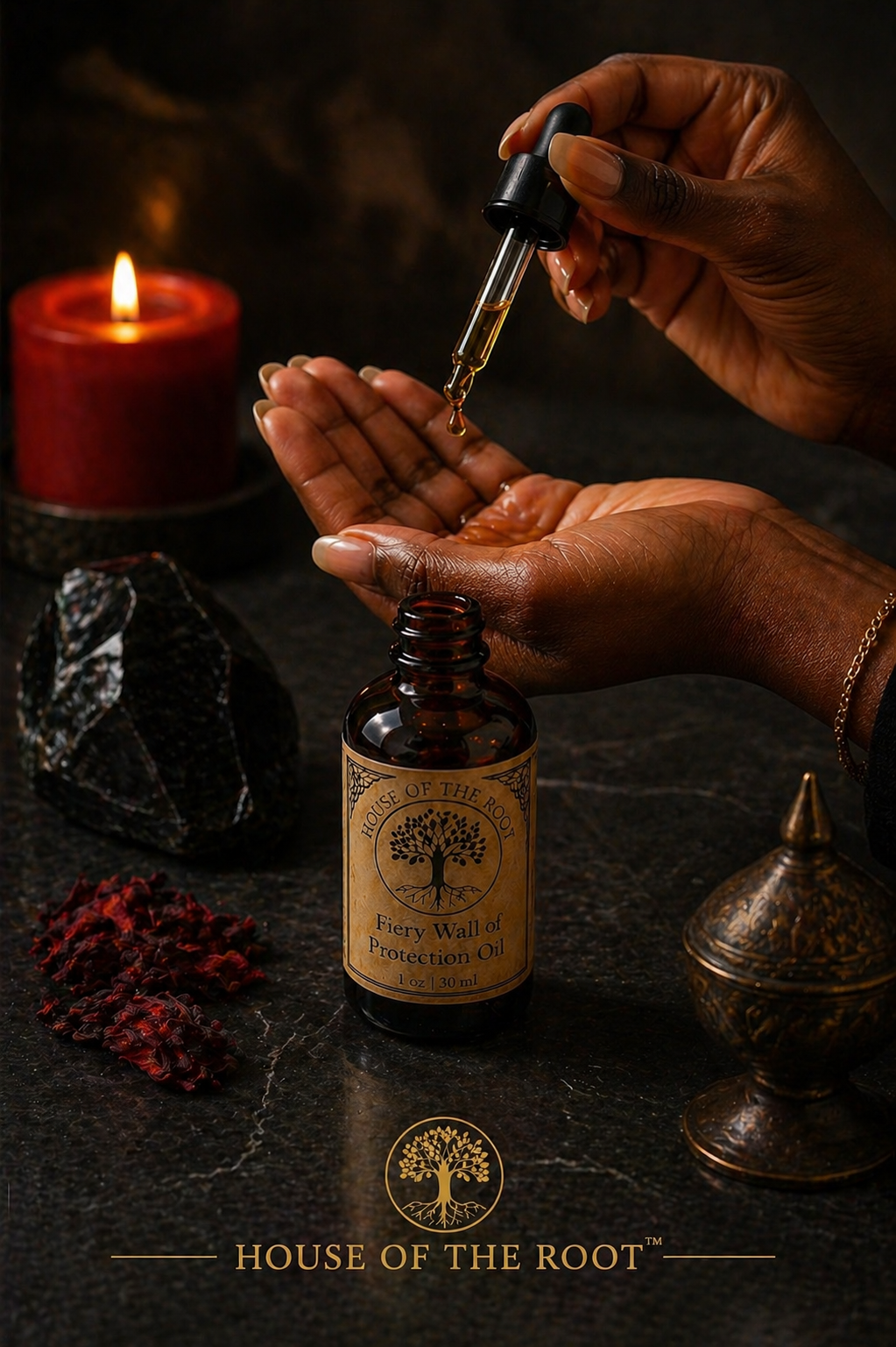 Black woman applying Fiery Wall of Protection Oil from dropper with amber bottle, obsidian stone, red herbs, and candle on dark surface