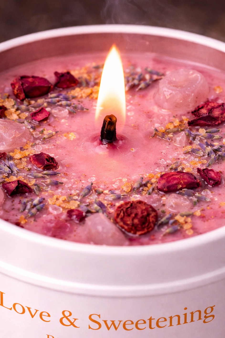 Macro close-up of Love & Sweetening Ritual Candle wax surface showing herbs, crystals, rose petals, lavender, and cinnamon used for love drawing and sweetening rituals.