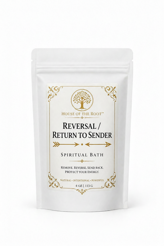 Reversal Return to Sender Spiritual Bath by House of the Root™ displayed in a clean, elevated setting with a matte white pouch and gold detailing, styled with minimal grounded elements representing reversal of negativity, protection and sending unwanted energy back to its source.
